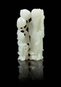 A Chinese White Jade Figural Group of Shoulao and Boy