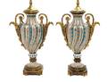 A Pair of Sevres Style Gilt Bronze Mounted Porcelain Urns