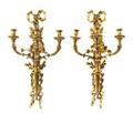 A Pair of Louis XVI Gilt Bronze ThreeLight Sconces