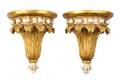 A Pair of Italian Painted and Parcel Gilt Wall Brackets