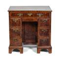 A George II Walnut Knee Hole Desk