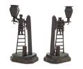 A Pair of Russian Bronze Figural Candlesticks