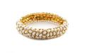 A Kenneth Jay Lane White and Goldtone Hinged Bracelet
