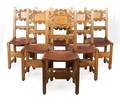 A Set of Twelve American Carved Wood Dining Chairs