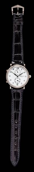 An 18 Karat White Gold Ref 5034G Travel Time Wristwatch Patek Philippe