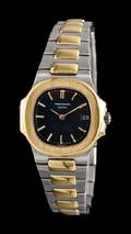 An 18 Karat Yellow Gold and Stainless Steel Ref 4700 Nautilus Wristwatch Patek Philippe