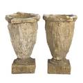 A Pair of Composition Garden Urns