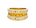 An 18 Karat Yellow Gold Yellow Sapphire and Diamond Ring