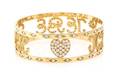 An 18 Karat Yellow Gold and Diamond Bangle Bracelet