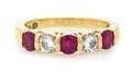An 18 Karat Yellow Gold Ruby and Diamond Band Ring Tiffany  Co