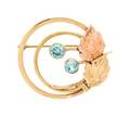 A Retro Rose Gold Yellow Gold and Blue Zircon Circle Brooch