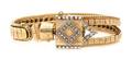 A 14 Karat Yellow Gold and Diamond Surprise Wristwatch