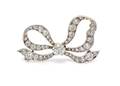 An Edwardian Platinum Topped Gold and Diamond Bow Brooch Tiffany  Co