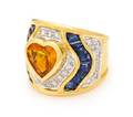An 18 Karat Yellow Gold Yellow Sapphire Sapphire and Diamond Ring