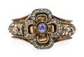 A Victorian Gilt Metal Sapphire and Multigem Bangle Bracelet