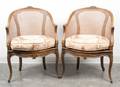 A Pair of Louis XV Style Walnut Corner Bergeres