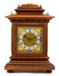 A Walnut and Brass Mantel Clock