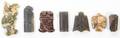 A Group of Seven Hardstone and Jade Toggles