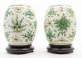 A Pair of Polychrome Enameled Porcelain Jars and Covers