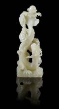 A Chinese White Jade Figure of a Dragon