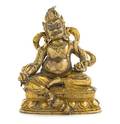 A Tibetan Gilt Bronze Figure of Jambhala