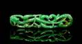 A Chinese Gold Mounted Pierce Carved Jadeite Brooch