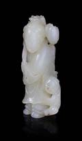 A Celadon Jade Figural Group