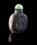 A Carved Chicken Bone Jade Snuff Bottle