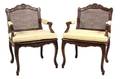 A Pair of Louis XVl Style Carved Walnut Fauteuils