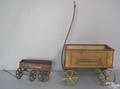Two wagons to include a painted wood Tanglefoot wagon