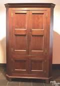Pennsylvania walnut onepiece corner cupboard ca 1800