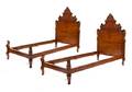 A Pair of Venetian Style Walnut Twin Beds
