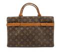 A Louis Vuitton Canvas Monogram Divided Purse