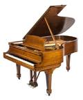 A Steinway and Sons Baby Grand Piano