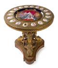 A Louis XVI Style Gilt Bronze and Sevres Porcelain Mounted Gueridon