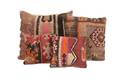 A Collection of Four Custom Upholstered Pillows