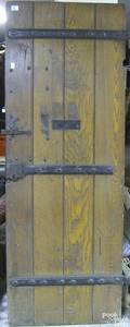 Oak door with wrought iron lock and hinges