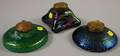 Three Brassmounted Iridescent Art Glass Inkwells