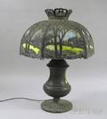Patinated Metal Table Lamp with Hexagonal Metal Overlay and Slag Glass Bent Panel Shade