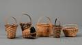 Six Small Woven Splint Handled Baskets
