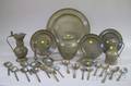 Ten Pieces of Pewter Tableware and Eighteen Spoons