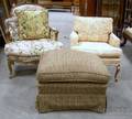 Two Louis XV Style Upholstered Carved Hardwood Armchairs and an Ottoman