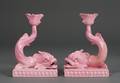 Pair of Wedgwood Pink Glazed Dolphin Candlesticks
