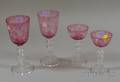 Four Pieces of Steuben Etched Cranberry Cut to Clear Glass Stemware