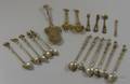 Eighteen Pieces of Italian and Venetian Brass and Metal Figural Flatware