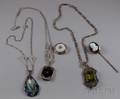 Two Art Deco Style Pendant Necklaces an Art Nouveau Silver and Enamel Pendant a Carved Onyx Stickpin and a Vi