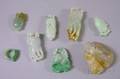 Eight Carved Jade and Stone Pendants and Other Items