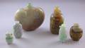 Six Carved Asian Jade and Stone Snuff Bottles