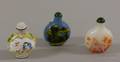 Two Carved Glass Snuff Bottles and an Enamel Snuff Bottle
