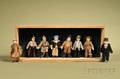 Eight Small Bisque Gentlemen Figures in Shadowbox